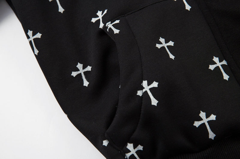 Close-up of black bomber jacket pocket seam with white cross print