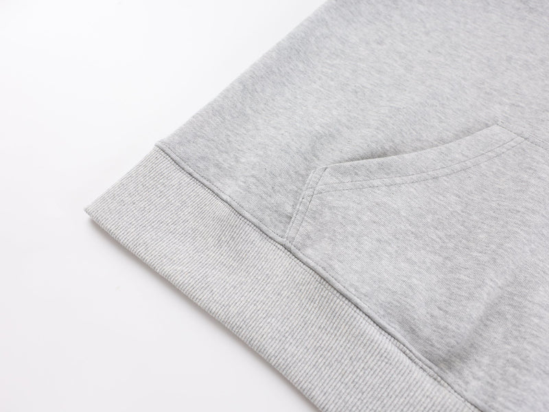 Close-up of gray hoodie sleeve and ribbed cuff detail
