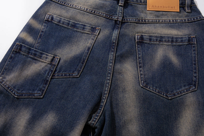 Back view close-up of jeans pockets and waistband in vintage blue denim