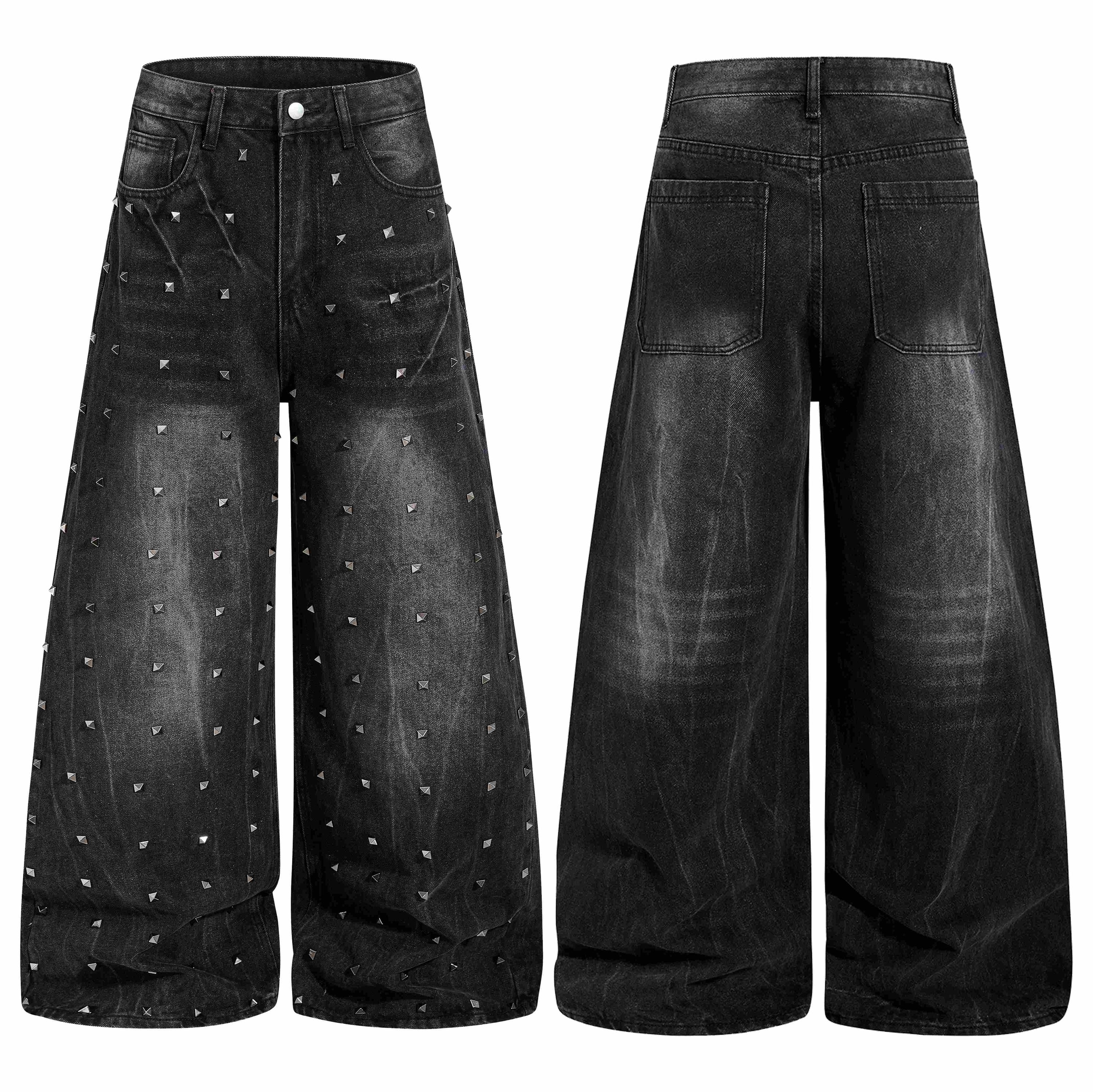 Front and back view of black wide-leg denim jeans with all-over silver pyramid studs and vintage wash finish