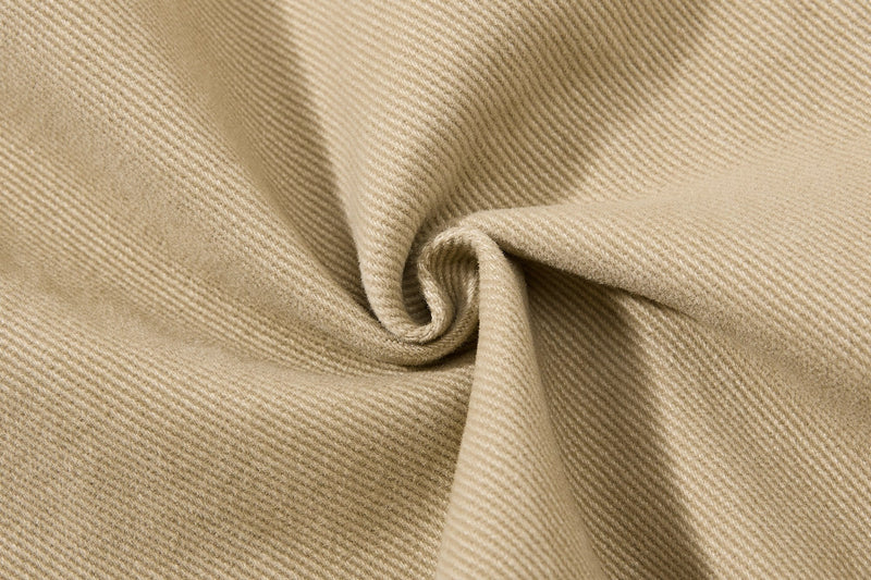 Close-up of khaki fabric texture with folded twill weave
