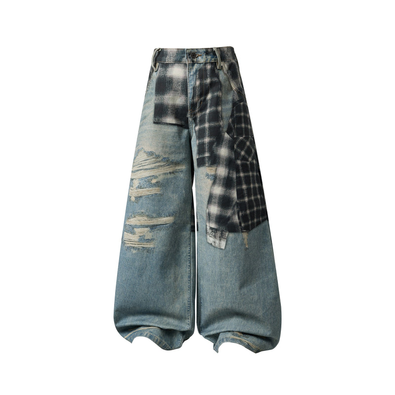 Front view of wide-leg patchwork jeans with faded blue denim, plaid panels and distressed rips