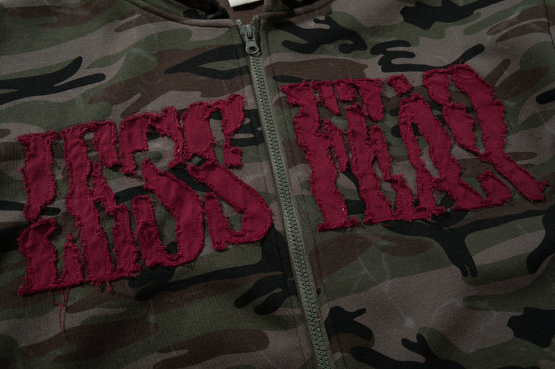 Close-up of burgundy chenille varsity lettering on camouflage hoodie front