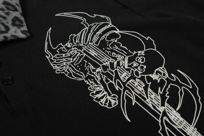 Black streetwear polo tee with white skeleton rock graphic and leopard print collar detail