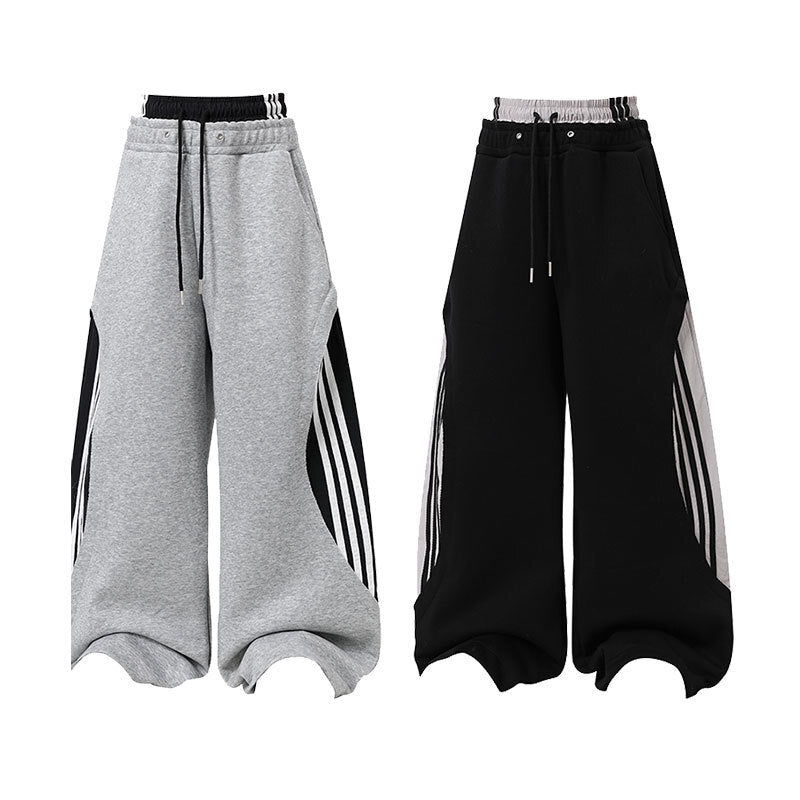 Heather grey oversized wide-leg sweatpants with double waistband and bold black and white stripe panels