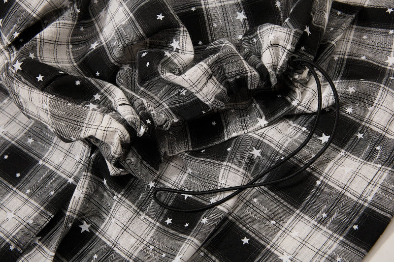 Gathered elastic drawstring waist on plaid cargo shorts with star print