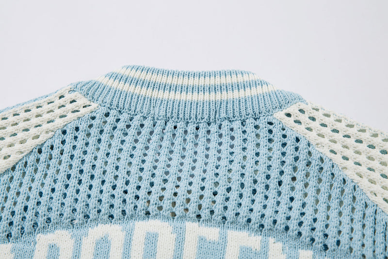 Close-up of light blue knit collar and open mesh texture at the back neckline