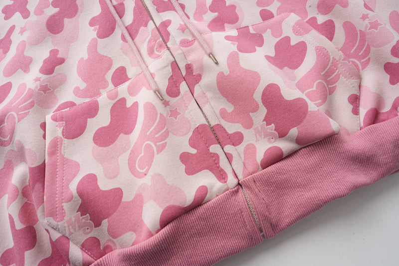 Close-up of pink camo hoodie front pockets, zipper, and ribbed hem