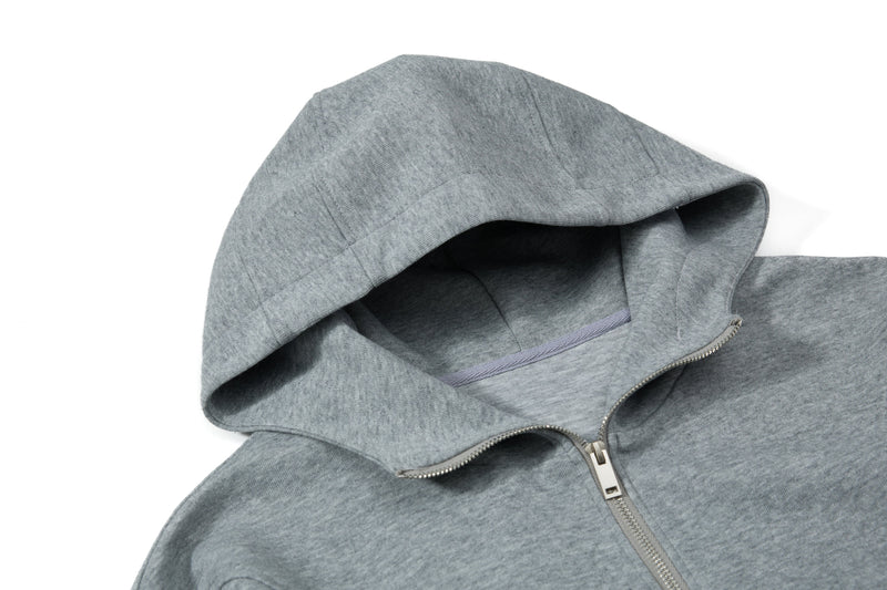Close-up of gray hoodie hood and zipper at the neckline