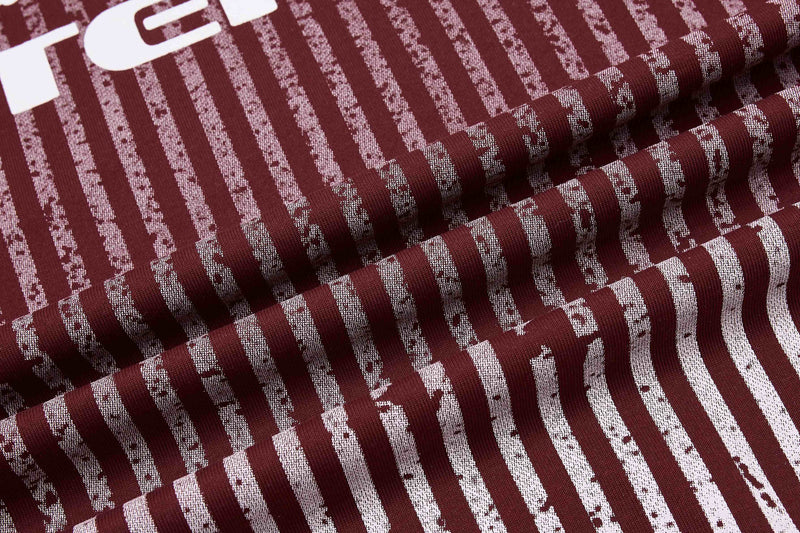Maroon striped sport tee fabric with white graphic print and folded textured knit detail