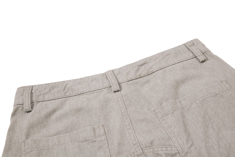 Beige back waistband and pocket detail on wide-leg cargo pants