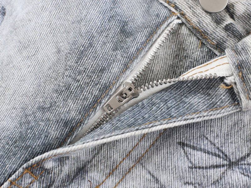Close-up of metal zipper and denim seam on gray washed pants
