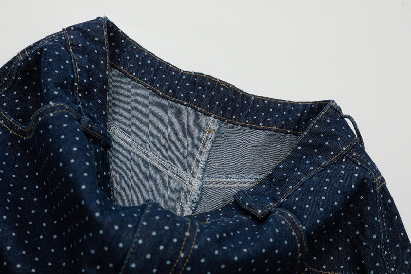Inside waistband view of navy polka dot denim cargo shorts showing light denim lining