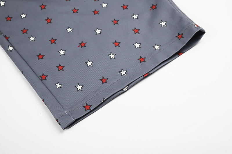 Lower hem of gray wide-leg jeans with red and white star print