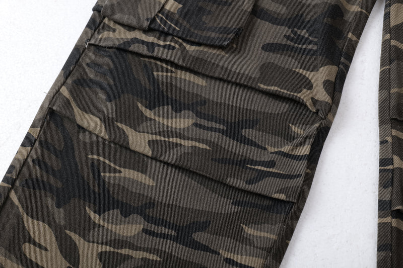 Close-up of side cargo pocket flap on camo wide-leg pants
