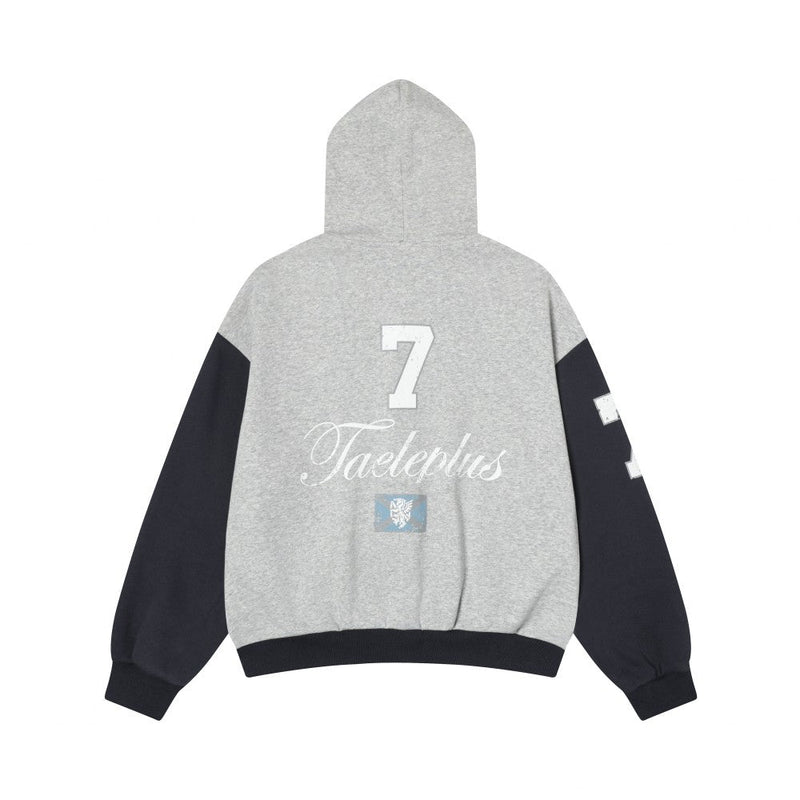 Back view of gray zip-up hoodie with black sleeves, large number 7, and Taeleplus script print