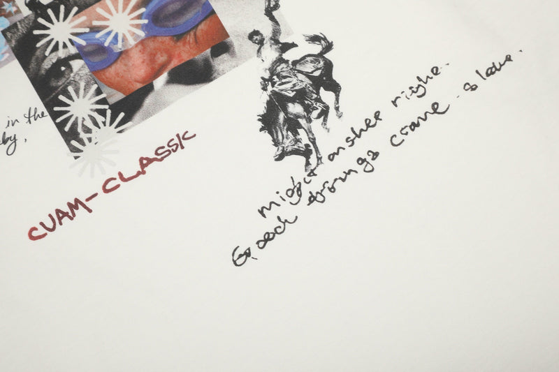 Close-up of front graphic and handwritten text on cream long sleeve tee