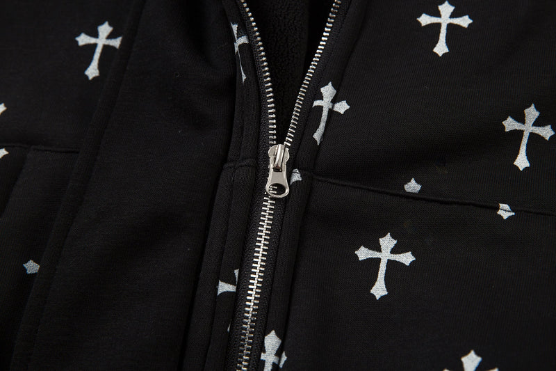Close-up of black bomber jacket front zipper and cross print pocket area