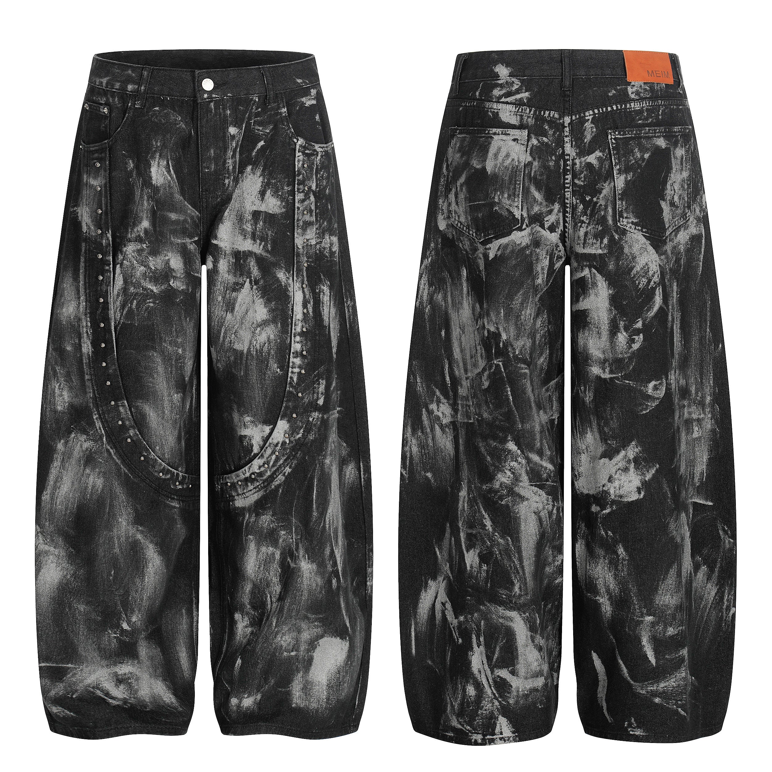 Front and back view of black wide-leg jeans with all-over paint-stroke print and silver studded crescent panel