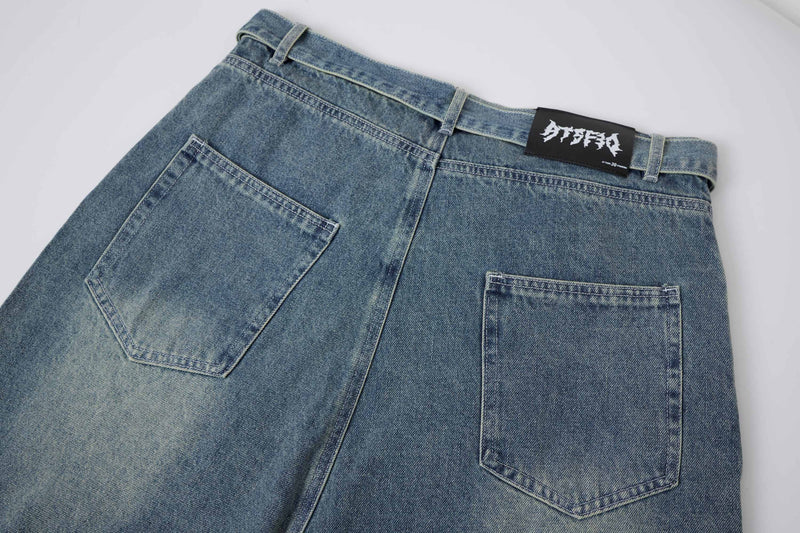 Back of light wash denim shorts with plain pockets and logo waistband patch
