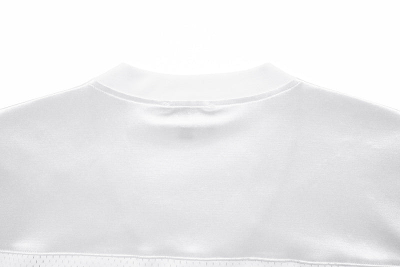 Close-up of white jersey back neckline and smooth satin fabric