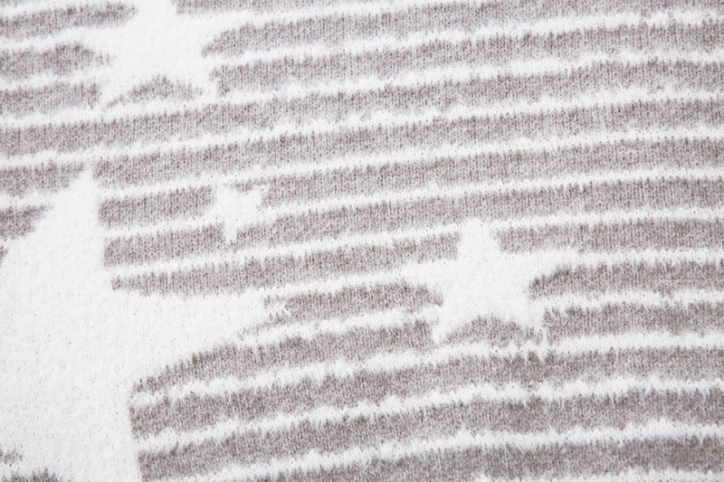 Close-up of the gray striped knit fabric with white star pattern