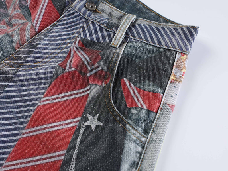 Front pocket area of patchwork jeans with striped denim and red tie print