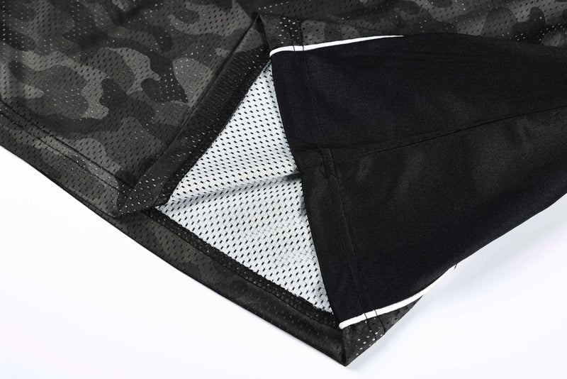 Close-up of a dark camo mesh athletic jersey with black sleeves and white trim detail