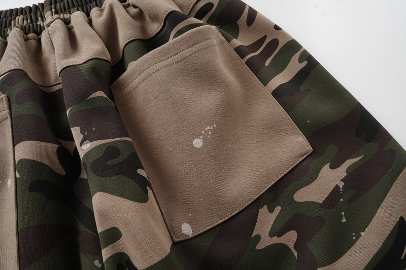 Close-up of back pocket and waistband on camo patchwork shorts