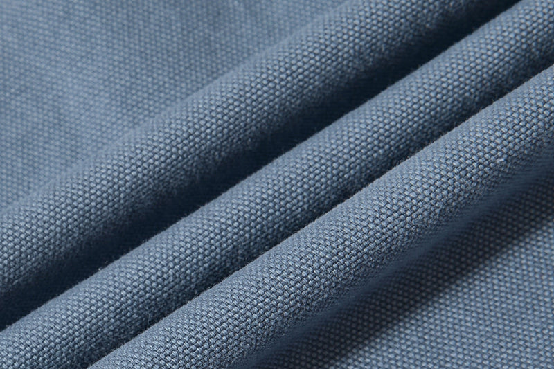 Close-up of blue cargo pant canvas-like fabric texture