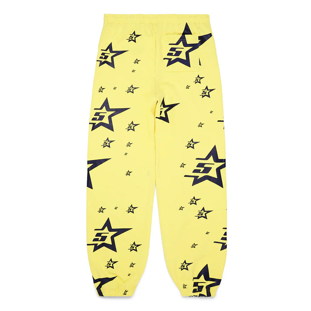 Unisex yellow cotton sweatpants inspired by Sp5der style, featuring an elastic waistband and cuffs with bold black star graphics and overlapping F logos in various sizes printed all over the fabric.