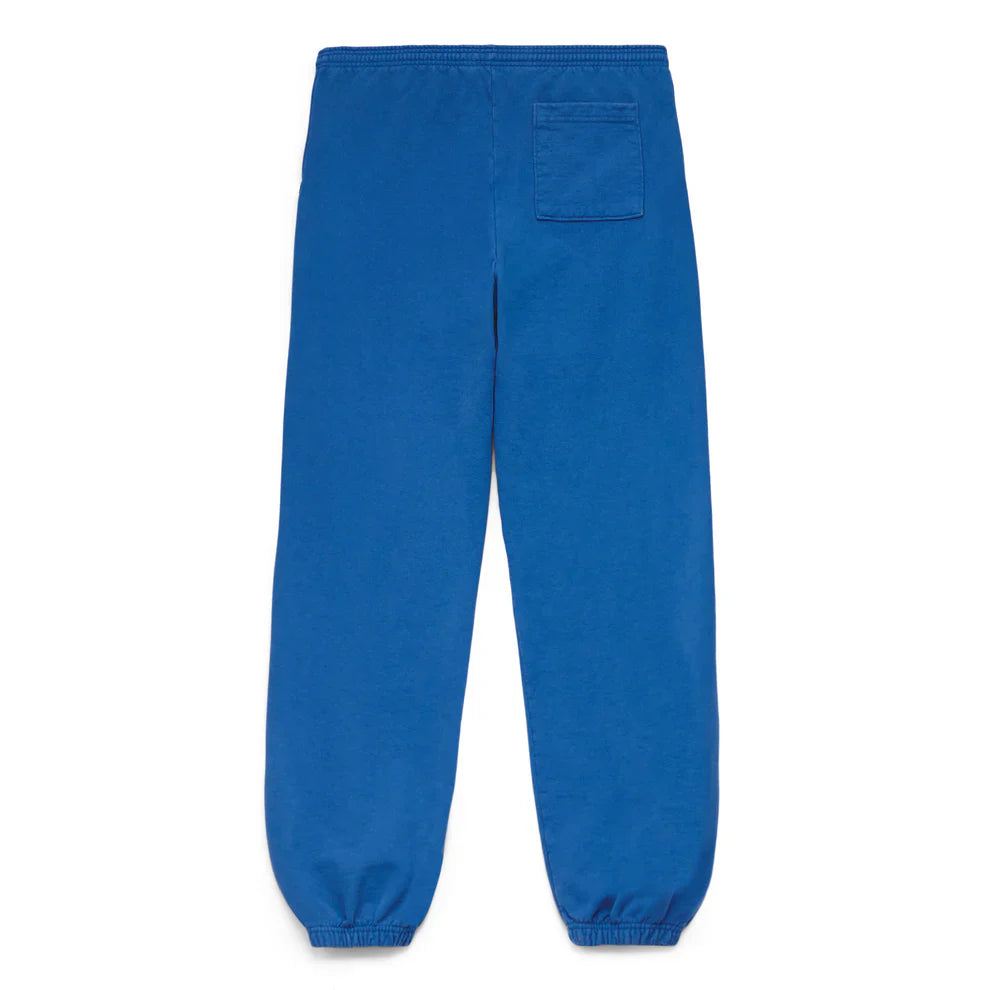 Unisex Sp5der Sweatpants in bright blue cotton, shown from the back with front logo print, elastic waistband and cuffs, and a single square back pocket on the right—ideal for streetwear style.
