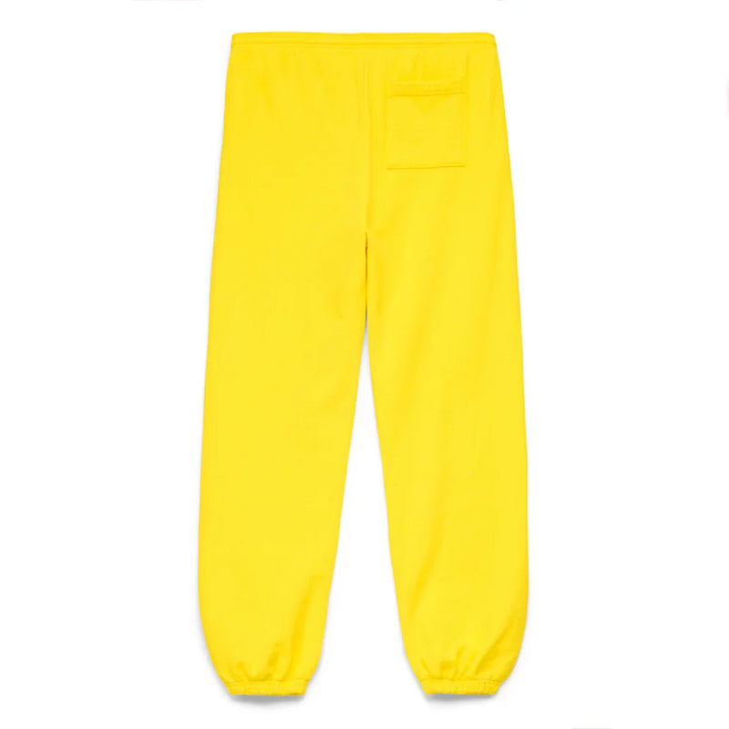 Sp5der Sweatpants – Unisex yellow cotton sweatpants with front logo print, elastic waistband and cuffs, and a single upper-right pocket, shown from the back and laid flat on a white background.