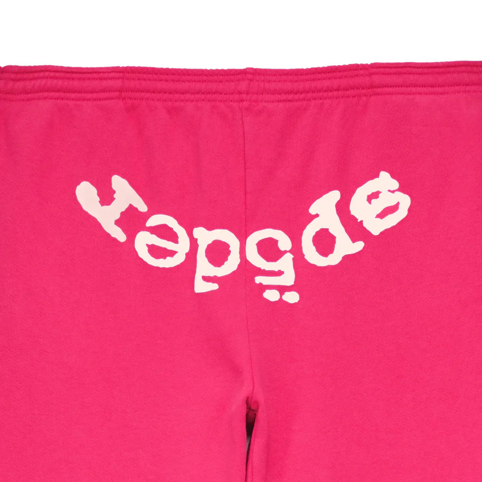 The Sp5der Sweatpants are unisex pink cotton joggers featuring a bold front logo print, combining comfort and standout streetwear style.