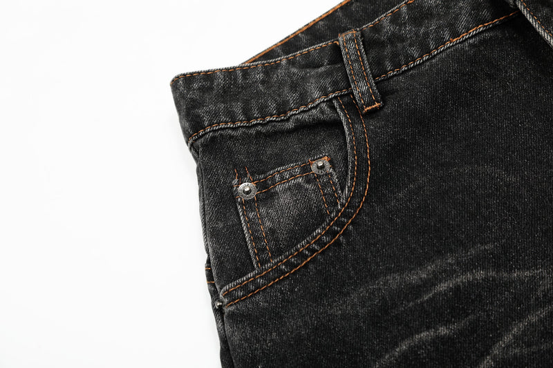 Front pocket and belt loop detail on black vintage wash denim