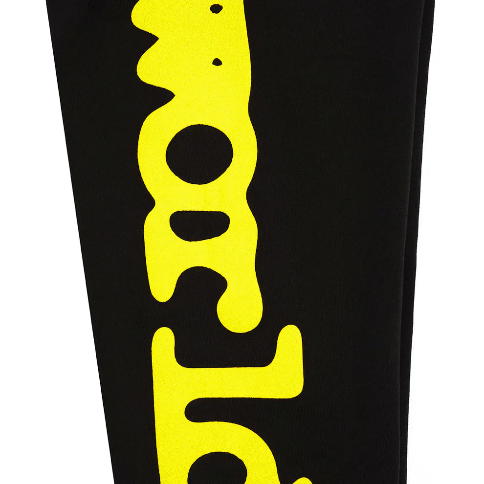 Sp5der Sweatpants Black Yellow Side Logo Print—100% cotton jogger pants with bold, wavy yellow text along the leg; perfect streetwear for trendsetters.