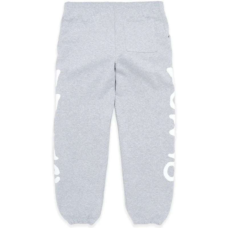 100% Cotton Sp5der Sweatpants for Men – Grey streetwear jogger pants featuring a relaxed fit, elastic waistband and cuffs, right back pocket, and bold white graphic print down both outer legs.