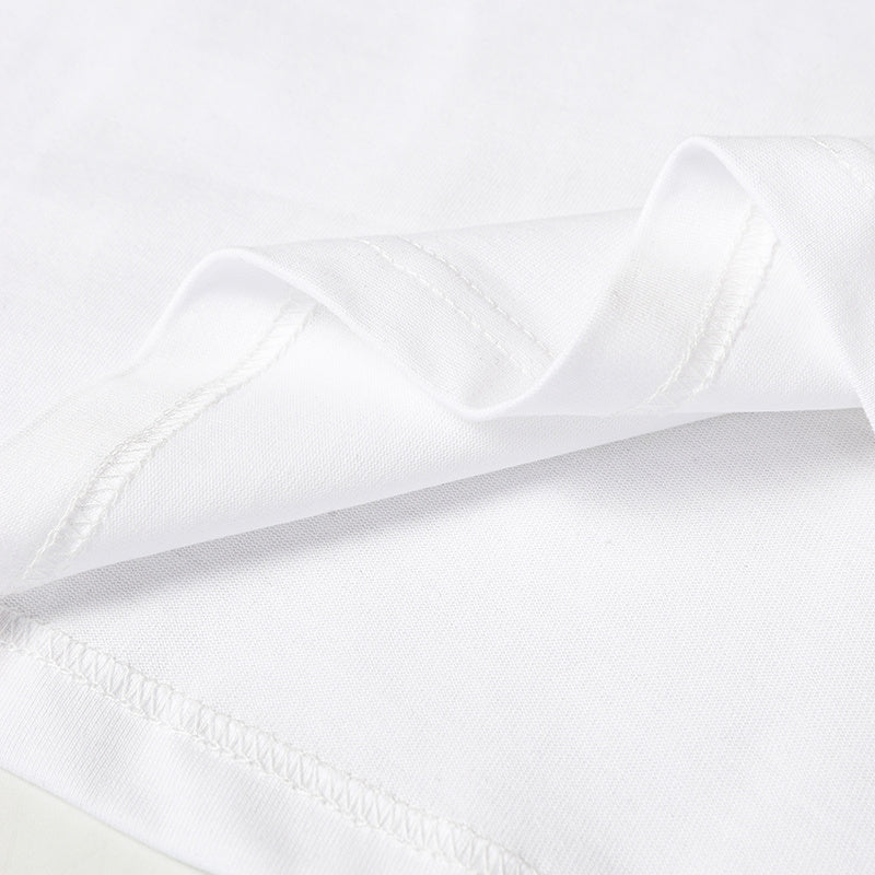Close-up of white cotton jersey fabric with stitched seams and smooth football-inspired striped texture