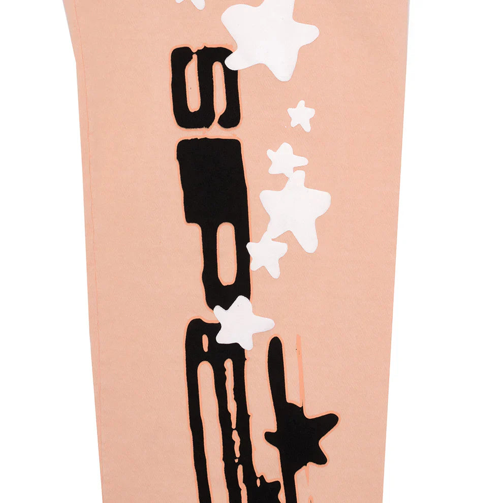 Unisex 100% cotton Sp5der peach jogger sweatpants featuring a relaxed fit, vertical logo, and black and white star graphics—ideal for streetwear style.