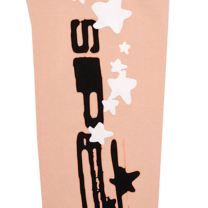 Unisex 100% cotton Sp5der peach jogger sweatpants featuring a relaxed fit, vertical logo, and black and white star graphics—ideal for streetwear style.