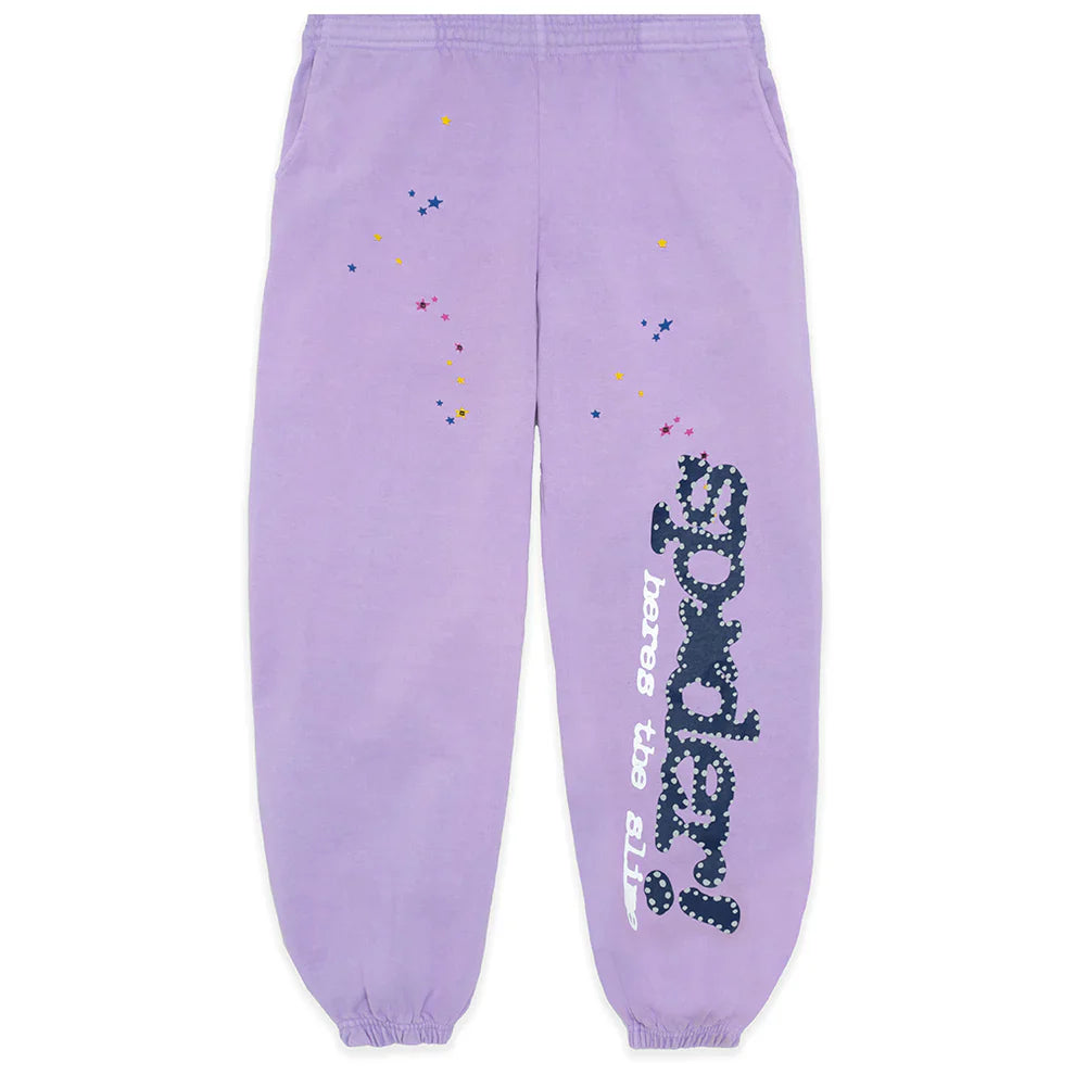 Unisex lavender Sp5der jogger pants made from 100% cotton, featuring a relaxed fit, vertical logo, star details, and elastic waistband and cuffs—a standout streetwear essential.