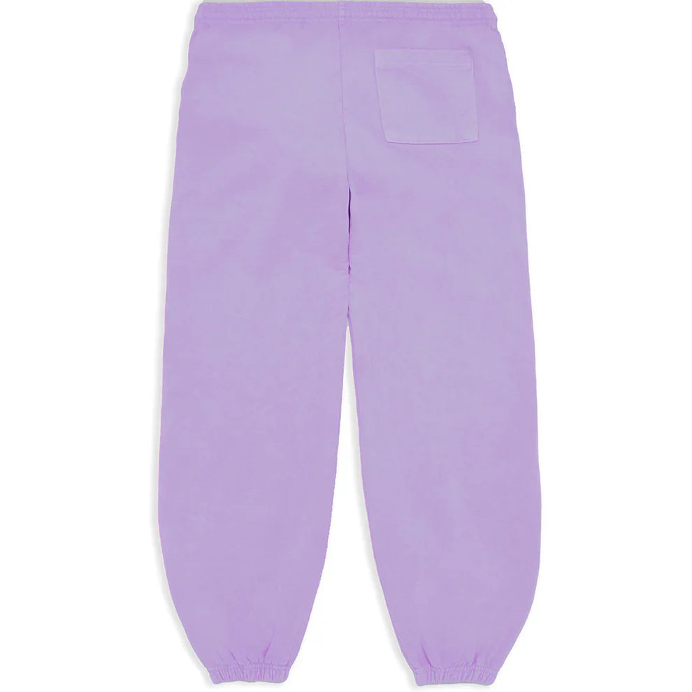 Unisex lavender Sp5der sweatpants made from 100% cotton, shown from the back. Features an elastic waistband and cuffs, a single upper-right patch pocket, relaxed fit, plus vertical logo and star details for streetwear style.