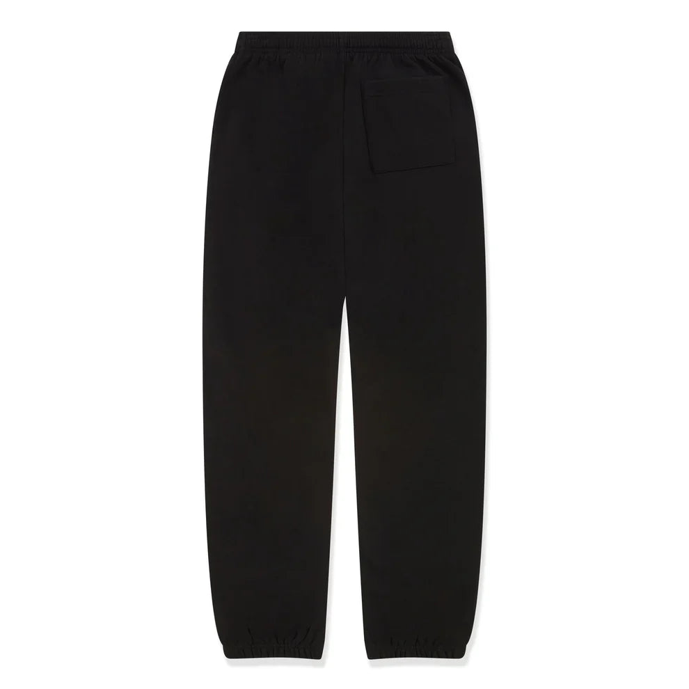 100% Cotton Sp5der Sweatpants in black shown from the back, with a relaxed unisex fit, elastic waistband, single right back pocket, elastic ankle cuffs, and pink logo graphics—perfect for streetwear style.