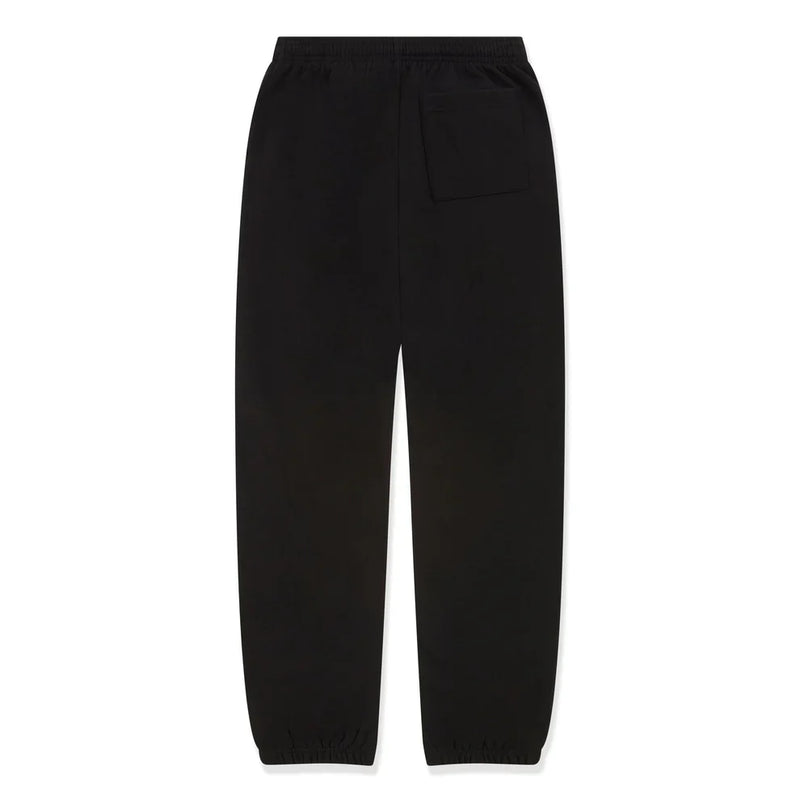 100% Cotton Sp5der Sweatpants in black shown from the back, with a relaxed unisex fit, elastic waistband, single right back pocket, elastic ankle cuffs, and pink logo graphics—perfect for streetwear style.