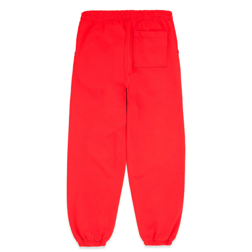 The 100% Cotton Sp5der Sweatpants are unisex red jogger pants with a black logo, star graphics, elastic waistband and cuffs, two side pockets, and one back patch pocket. Laid flat with the back side facing up for streetwear style.