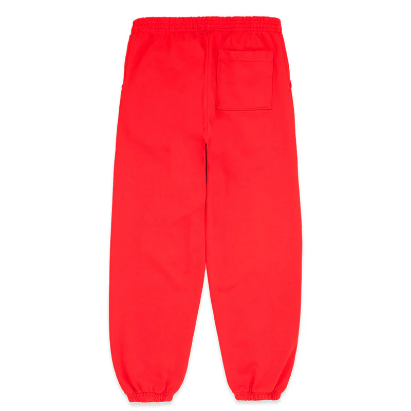 The 100% Cotton Sp5der Sweatpants are unisex red jogger pants with a black logo, star graphics, elastic waistband and cuffs, two side pockets, and one back patch pocket. Laid flat with the back side facing up for streetwear style.