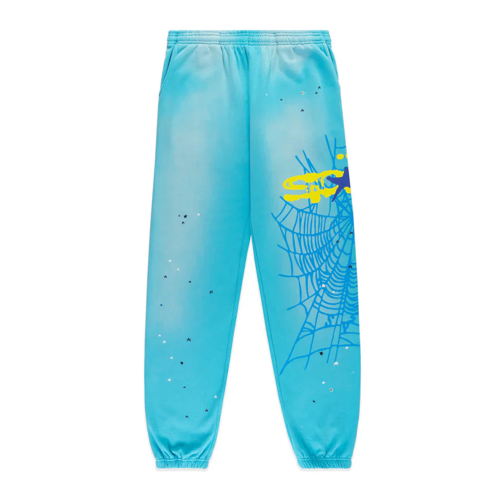 Unisex 100% cotton Sp5der sweatpants in light blue, featuring a relaxed fit, elastic waistband and cuffs, spider web graphic with star details—stylish jogger streetwear for all.