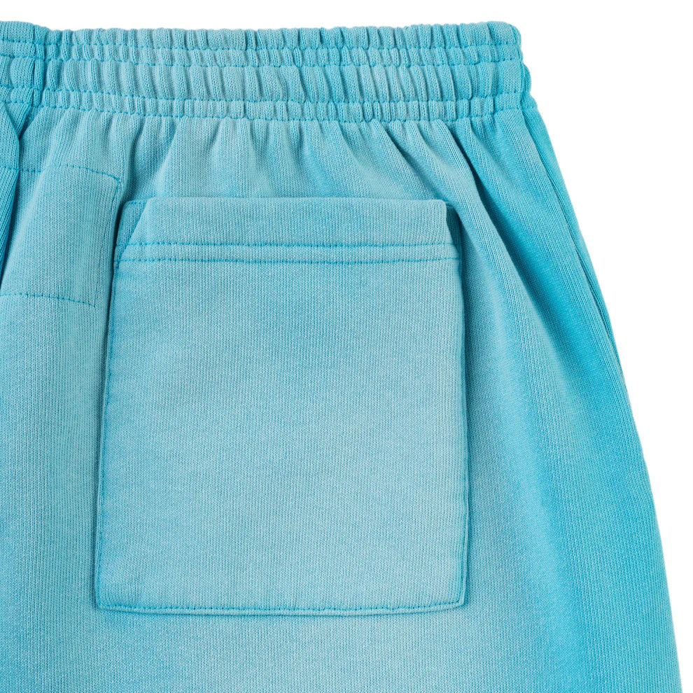 Close-up of 100% Cotton Sp5der Sweatpants—Unisex Blue Jogger Pants with a spider web graphic, star details, elastic waistband, rectangular back pocket, and relaxed fit for comfort and streetwear style.