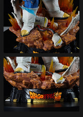 The image displays the base of a "Dragon Ball Z" Vegeta Collectible Figure by Seakoff, with rocky terrain and vibrant flames, featuring the "Dragon Ball Super" logo and part of Vegeta&