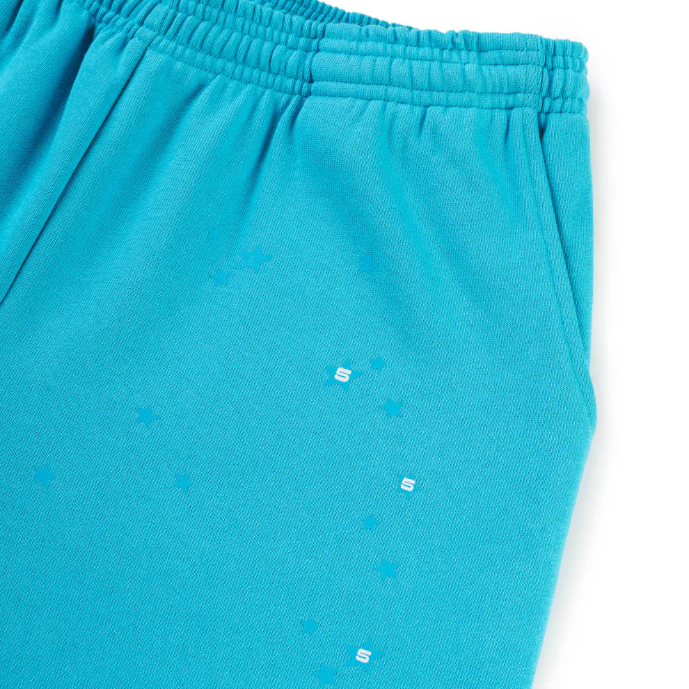 Close-up of 100% Cotton Sp5der Sweatpants – Unisex Teal Jogger Pants with orange logo print and relaxed fit. Features an elastic waistband and side pocket, perfect for comfortable streetwear style.